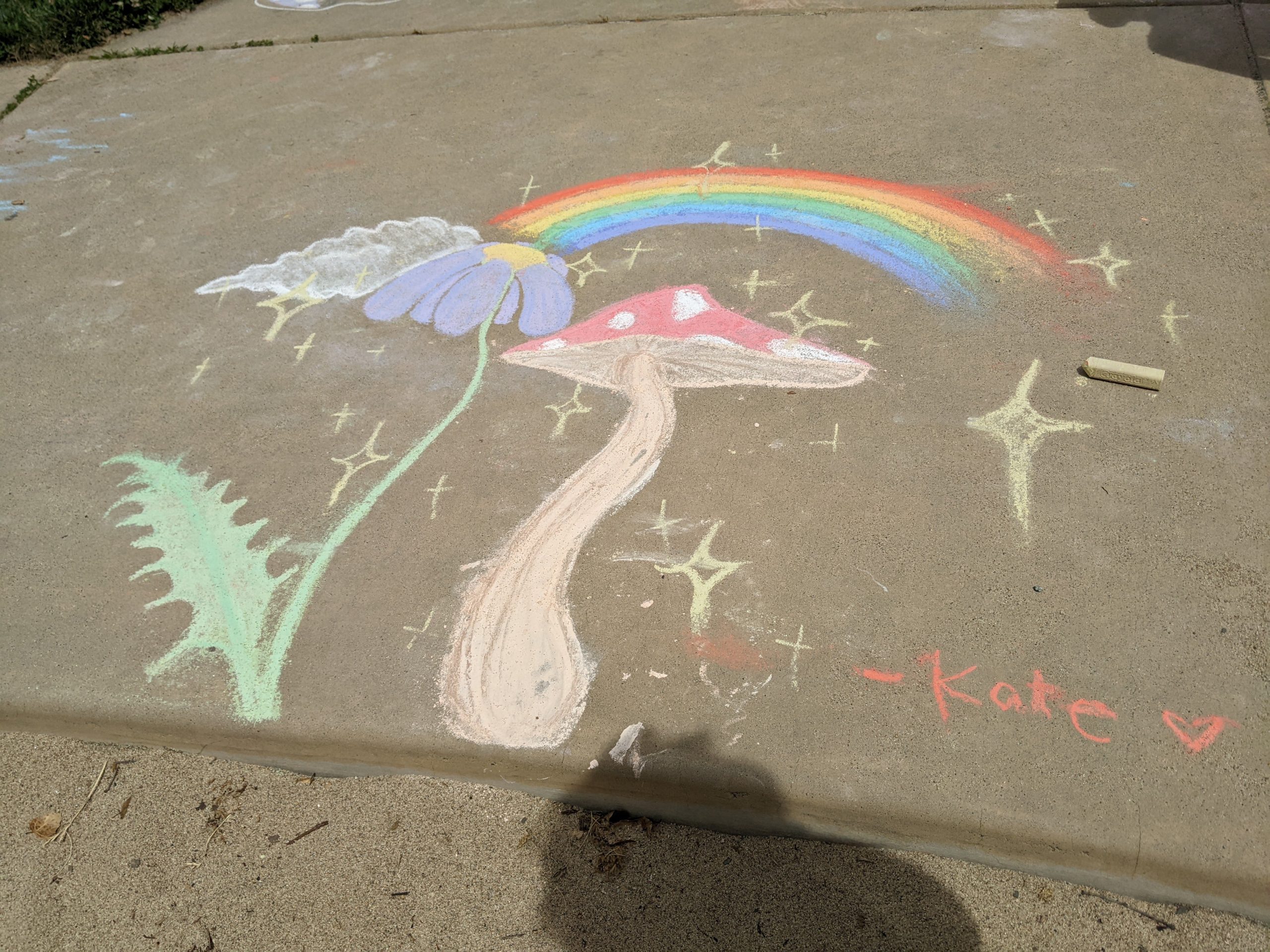 Rainbow and fairy mushrooms drawn with chalk